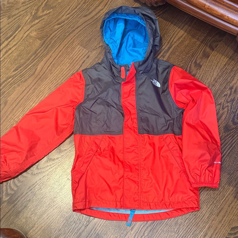 The North Face Kids Red and Gray Hooded Raincoat with Bright Blue Lining